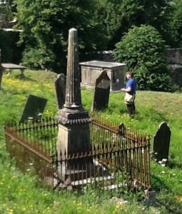 Reading headstone with the use of a mirror - Youghal Cemetry